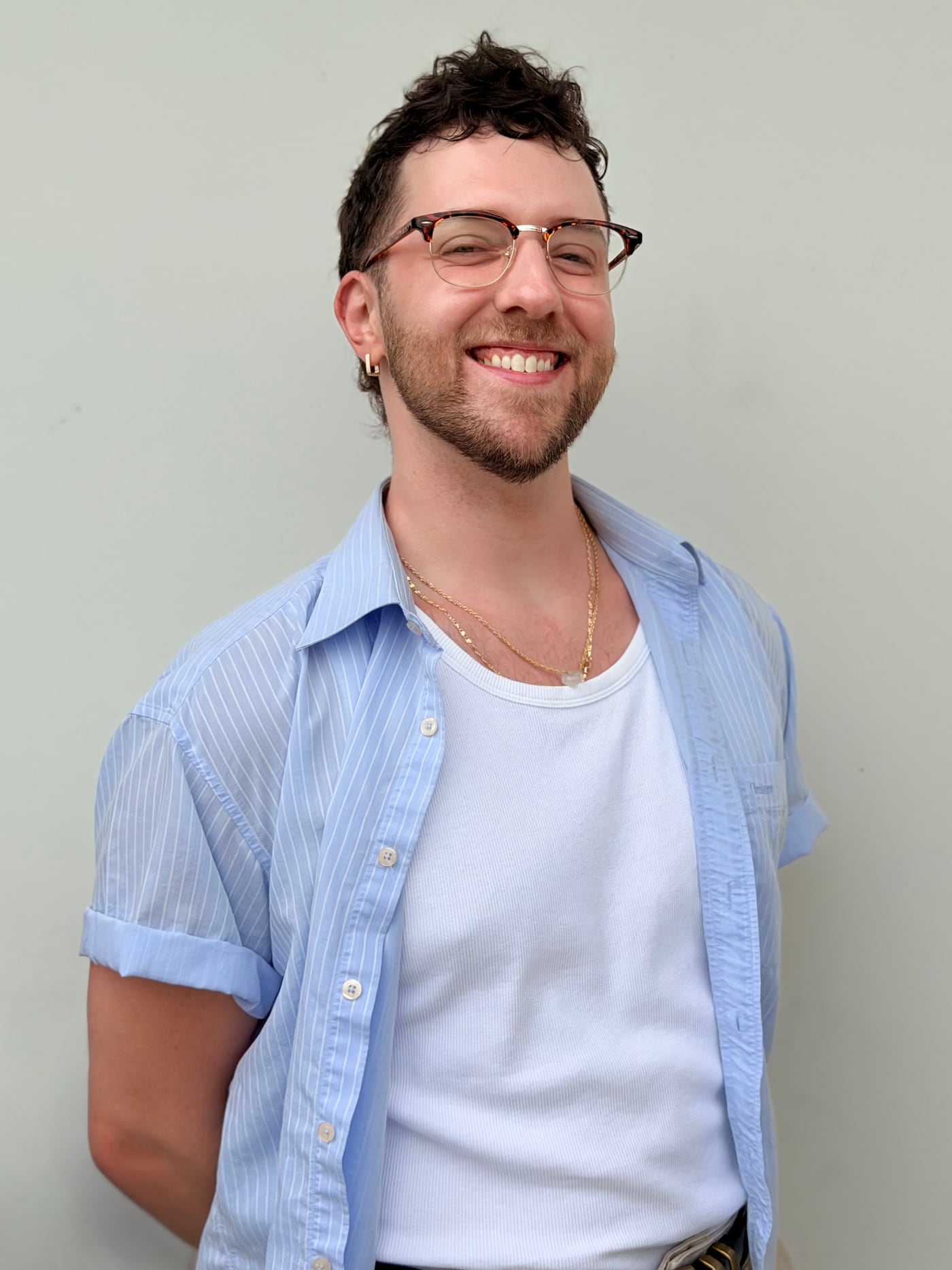 portrait of the video editor in a blue striped shirt